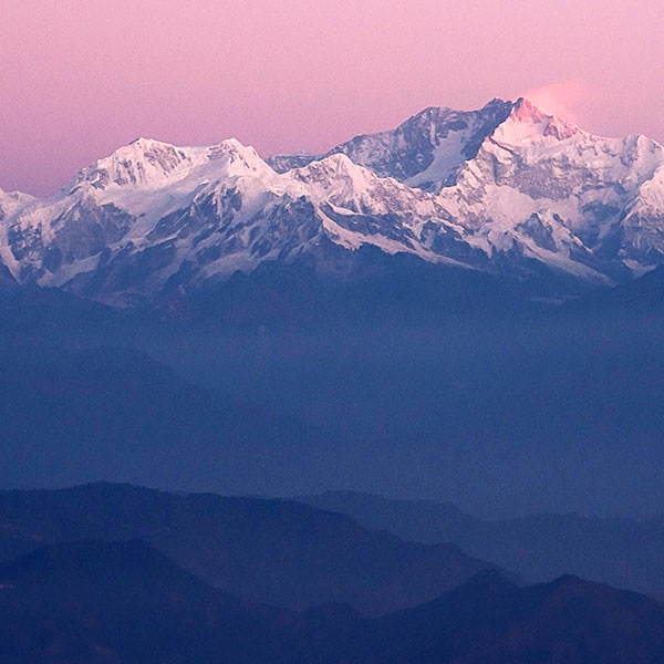 Two hands creating a heart and showing the sun